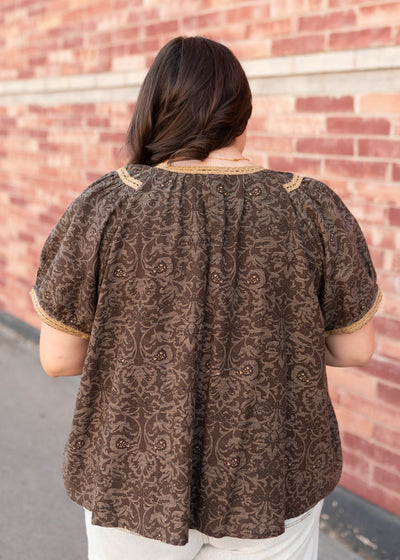 Back view of the plus size brown pattern top