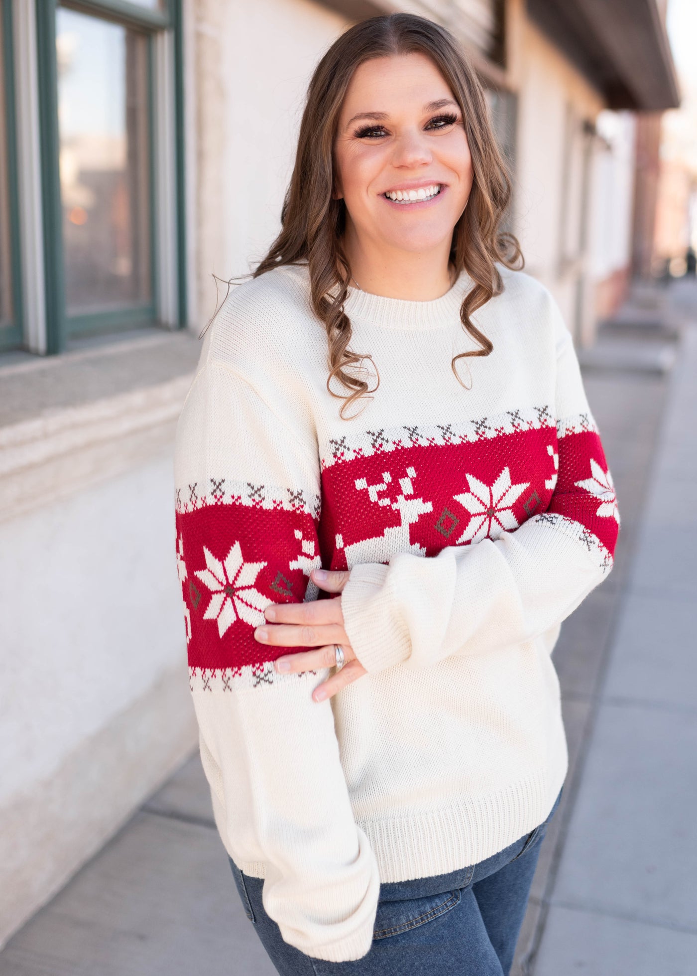 Side view of the plus size cream patterned sweater with long sleeves