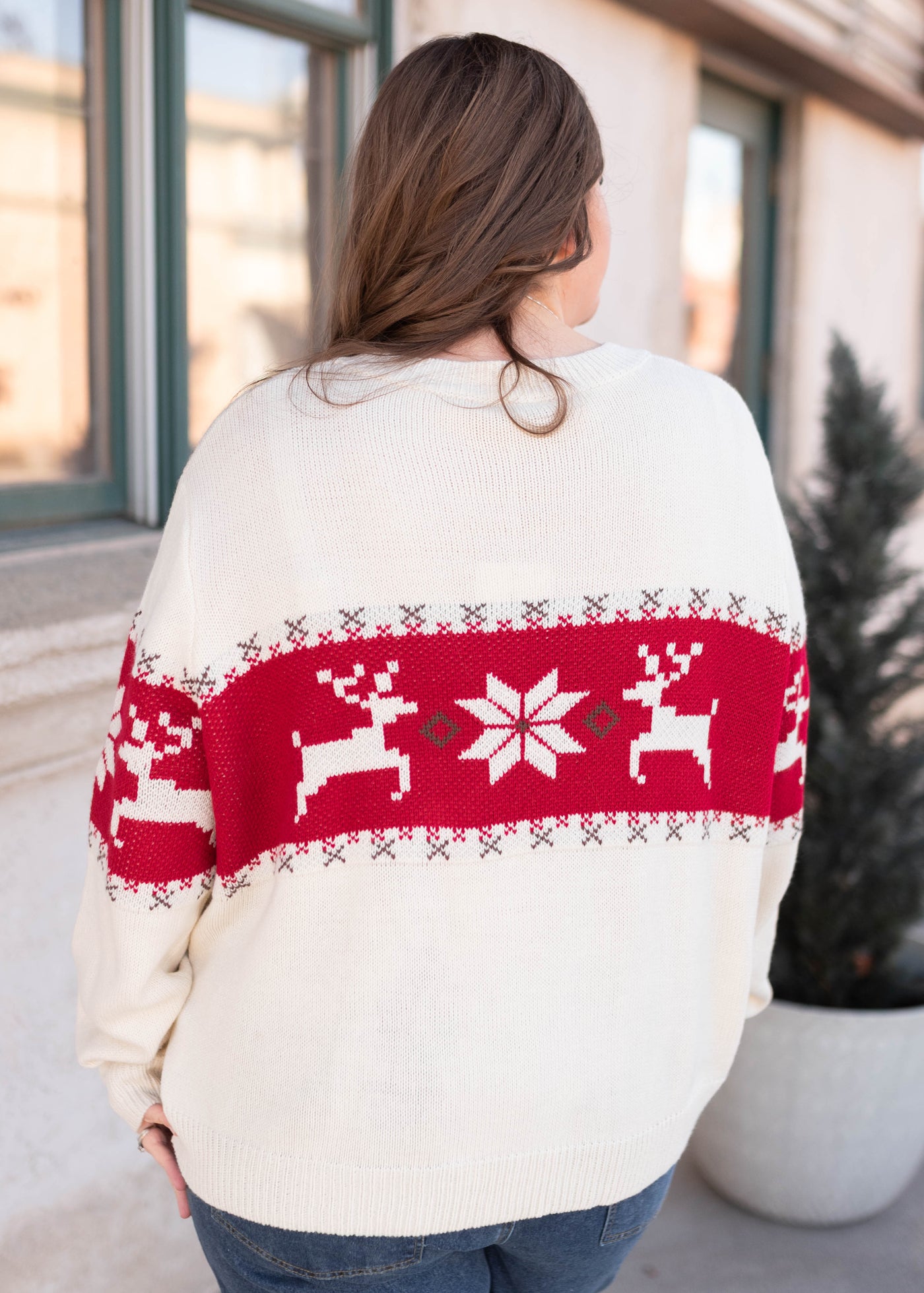 Back view of the Christmas cream patterned sweater in plus size