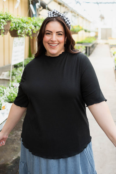 Plus size black textured knit top with short sleeves