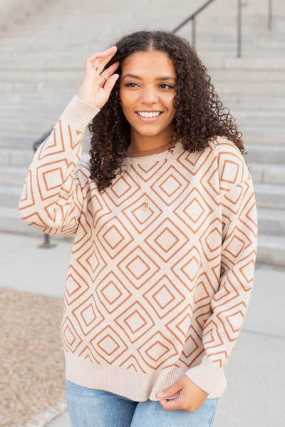 Oatmeal pattern sweater with oatmeal trim on hem and cuffs