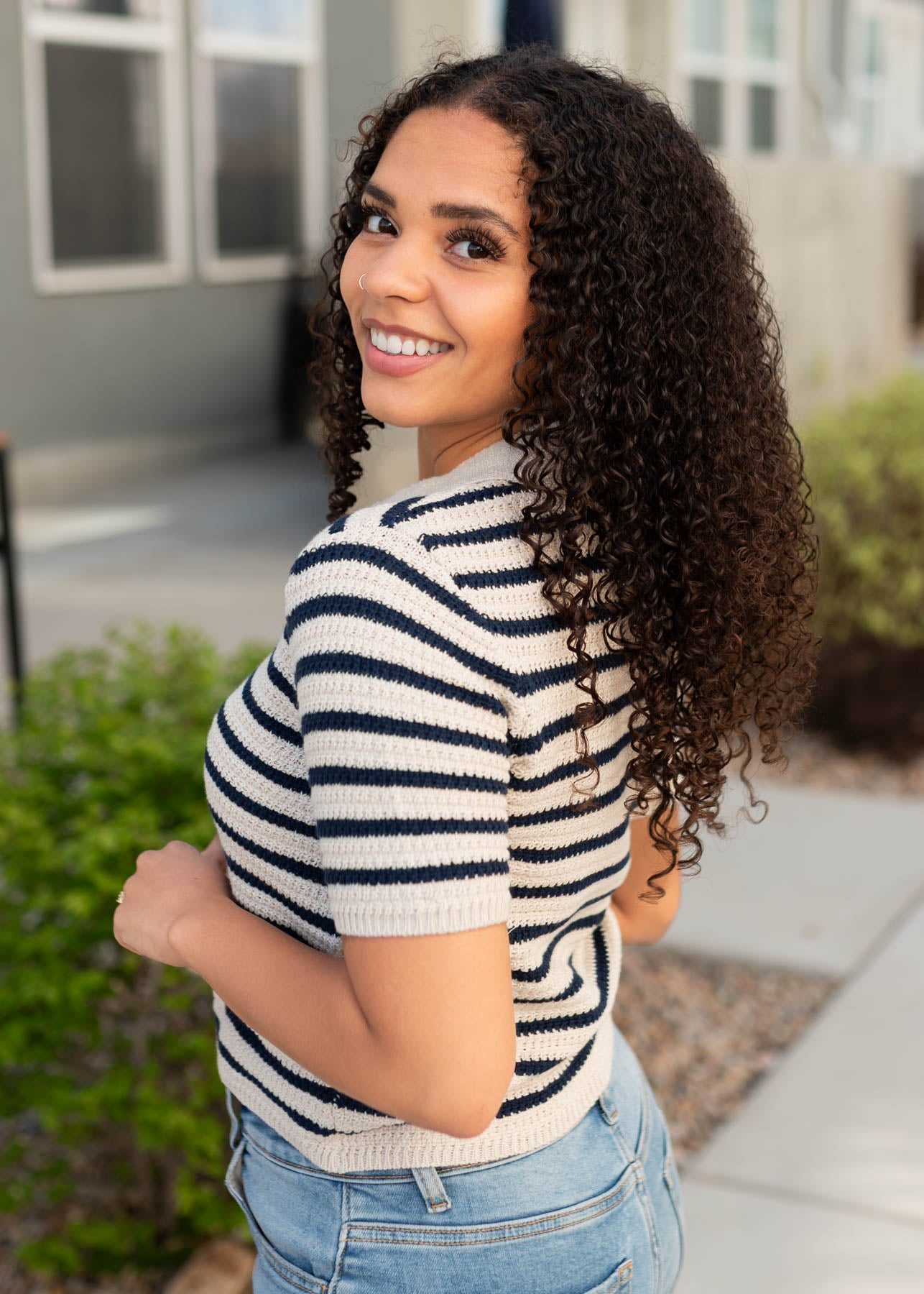 Side view of the navy striped knitted pollo top
