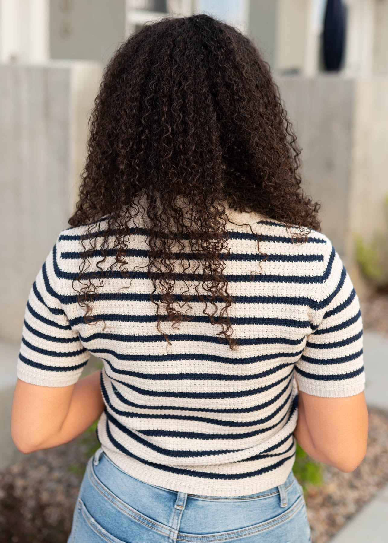 Back view of the navy stirped knitted pollo top