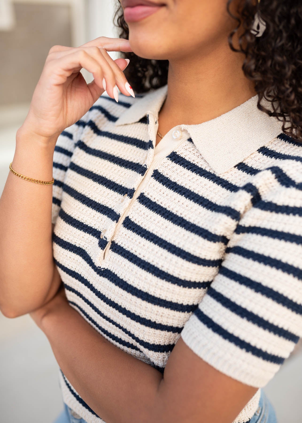 Close up of the navy striped knitted pollo top