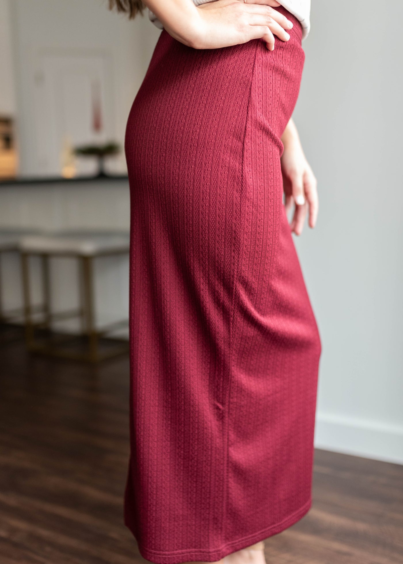 Side view of the burgundy midi skirt