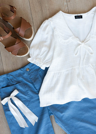 Flat layout of the cropped blue pants