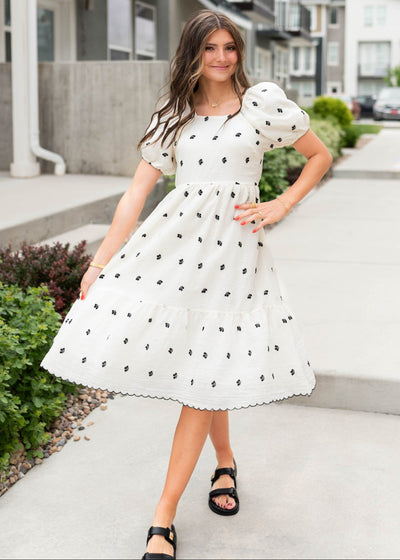 Ivory embroidered flroal dress with black stitch hem