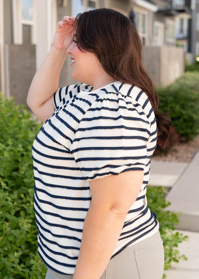 Side view of the navy striped top in plus size