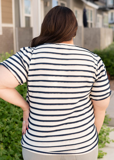 Back view of the plus size navy striped top