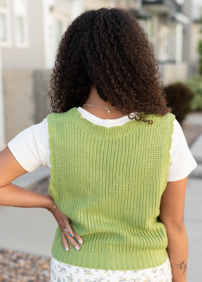 Back view of the green button up vest