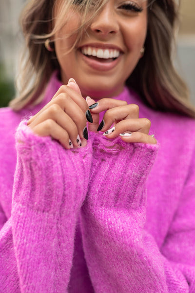 Distressing on the cuffs of a orchid sweater