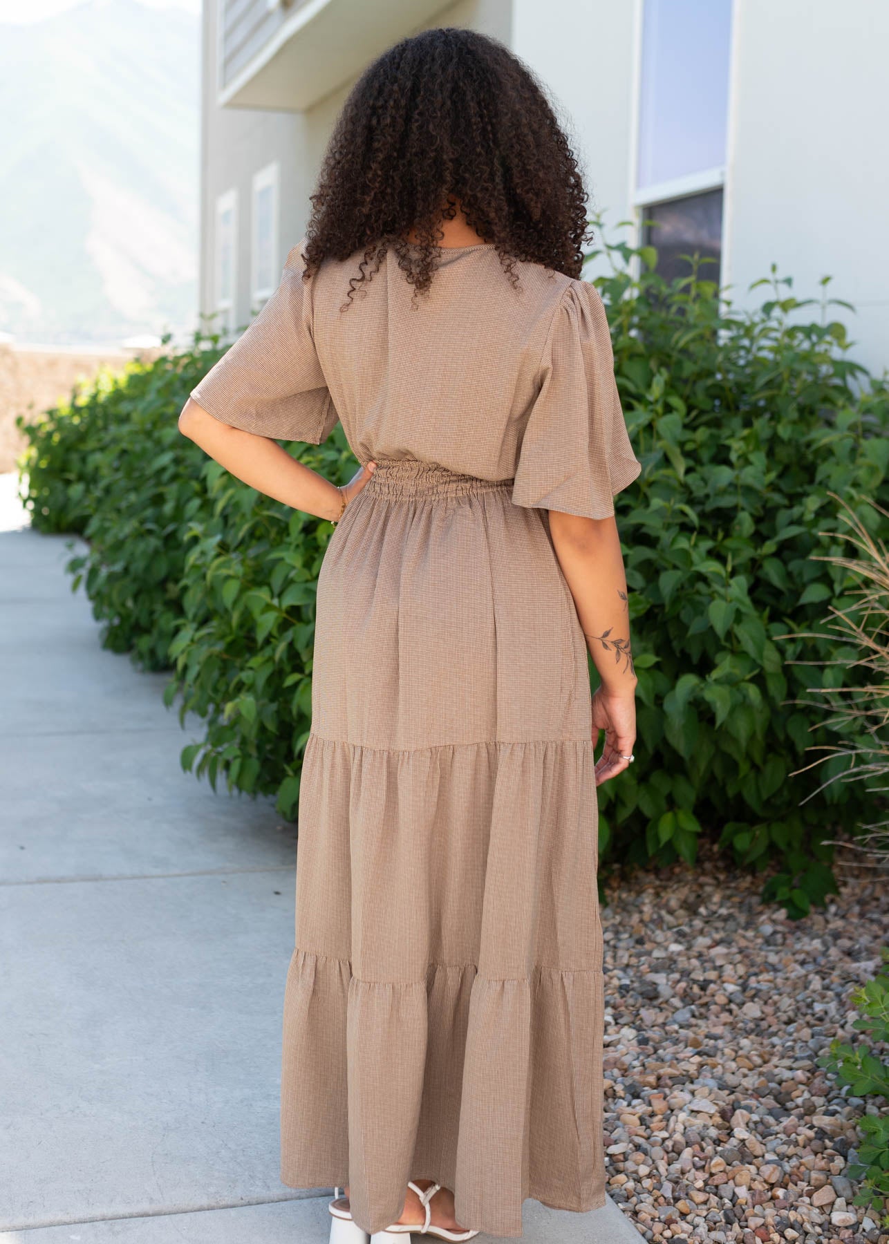 Back view of the pale brown tiered dress