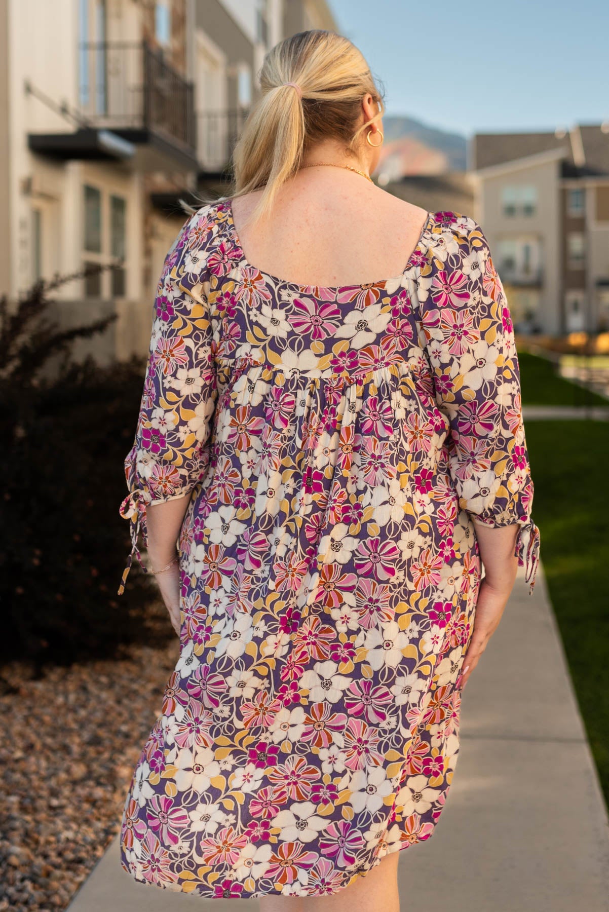 Back view of a violet floral dress