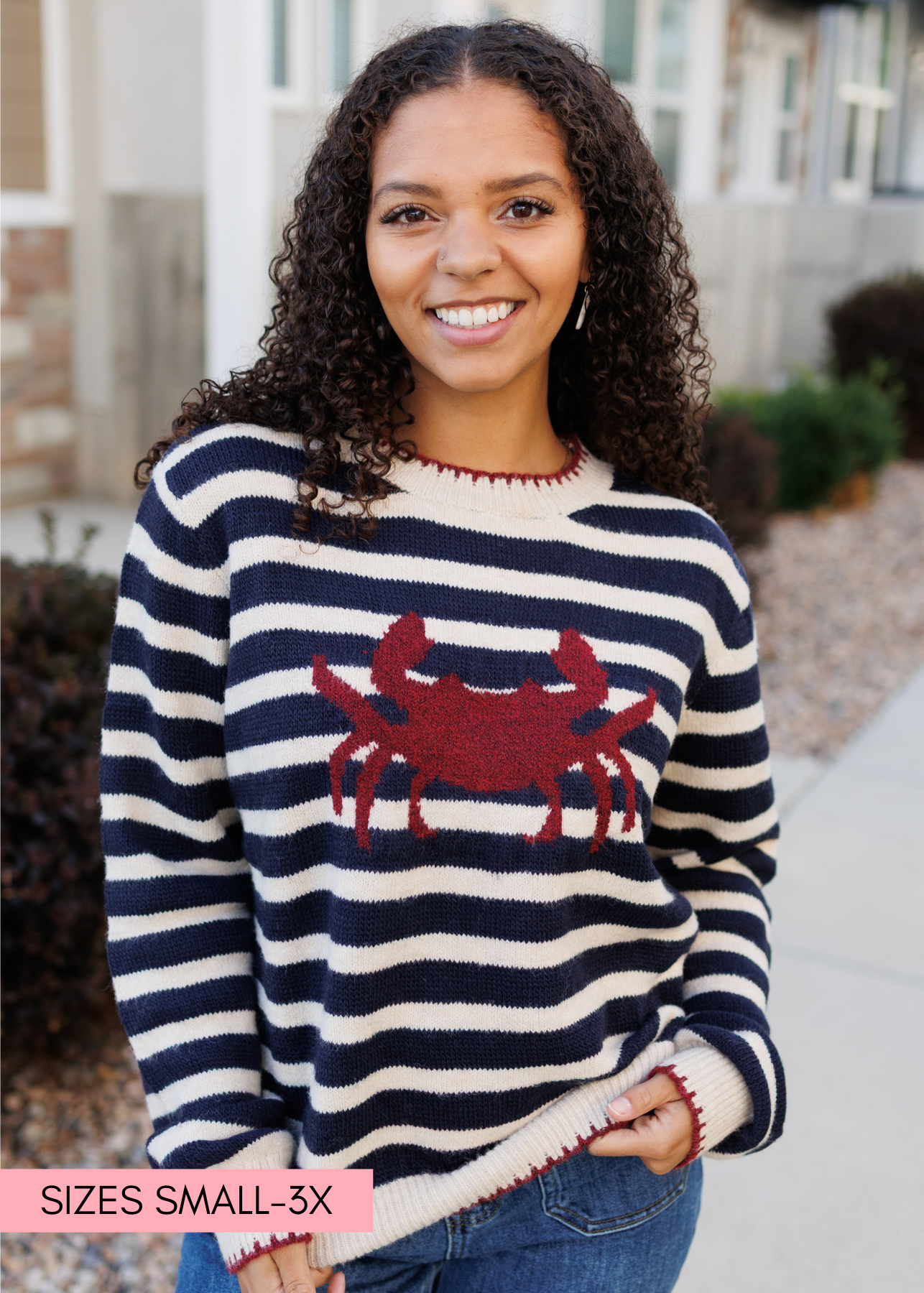 Long sleeve navy striped pattern sweater with a crab and red trim