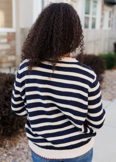 Back view of the navy striped pattern sweater