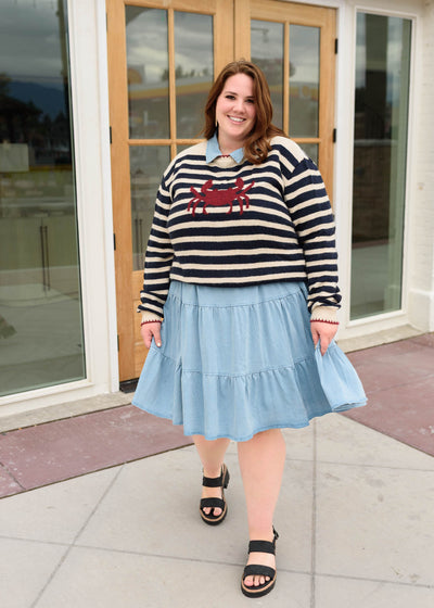 Plus size long sleeve cream and navy strped pattern sweater with a red crab