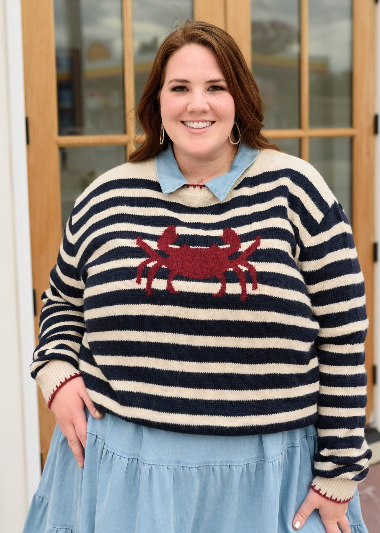 Plus size navy strped pattern sweater with a crab on the front