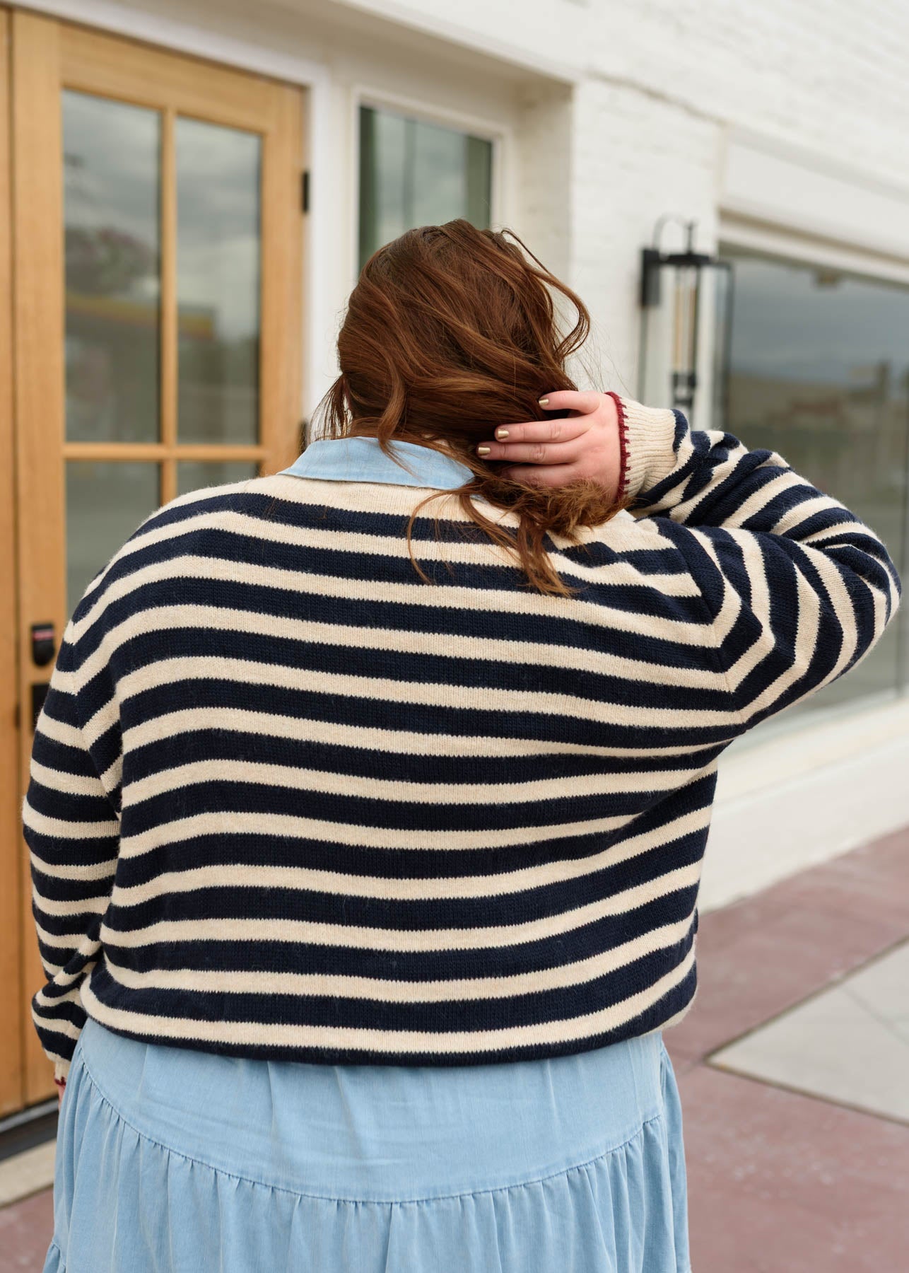 Back view of the plus size striped pattern sweater