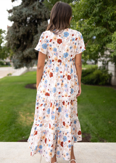 Back view of the cream floral dress with lace trim