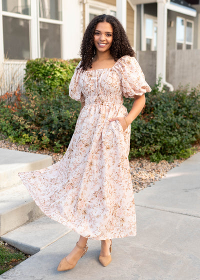 Pink floral dress with elastic waist and pockets