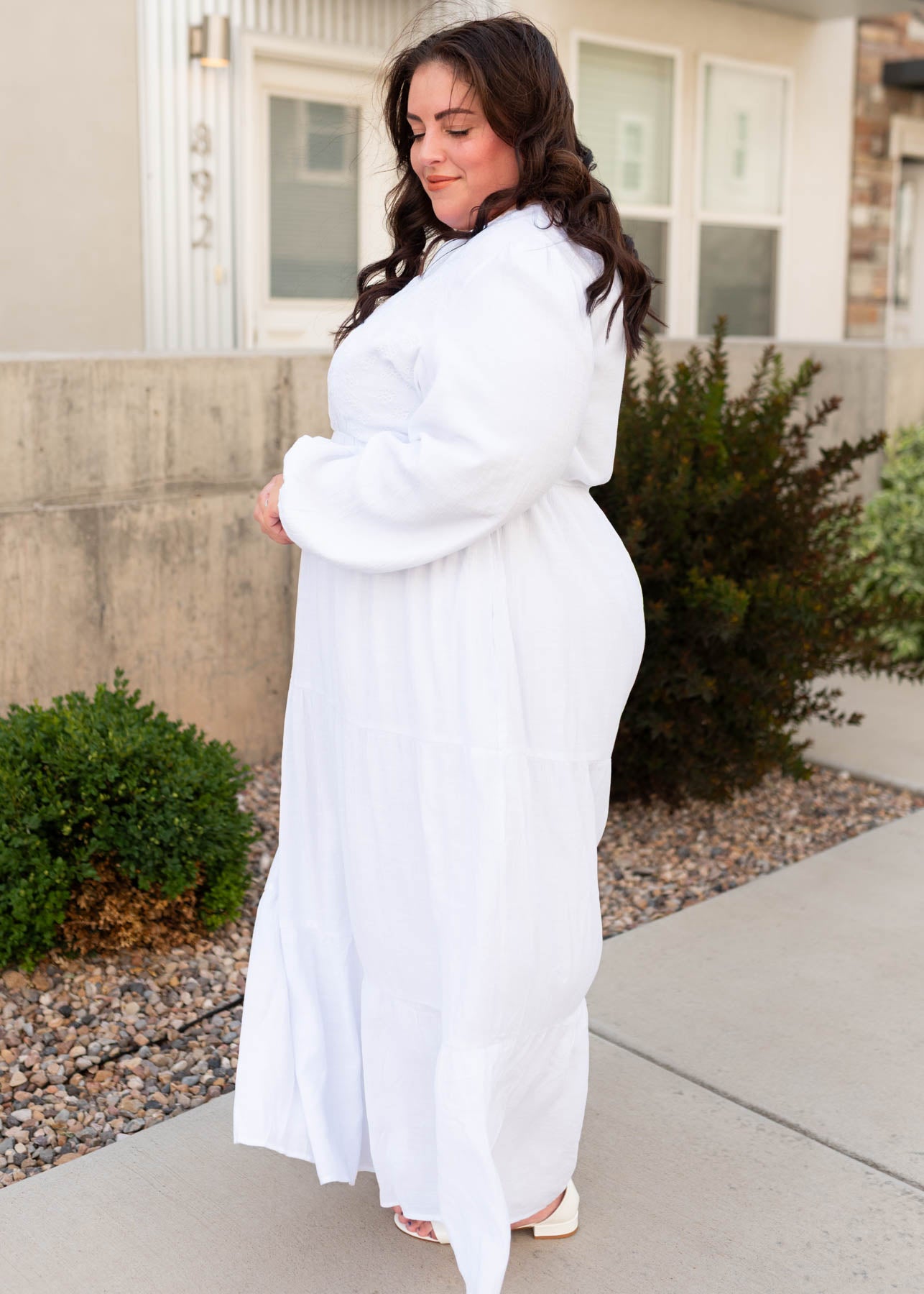 Side view of the white embroidered bodice dress in plus size