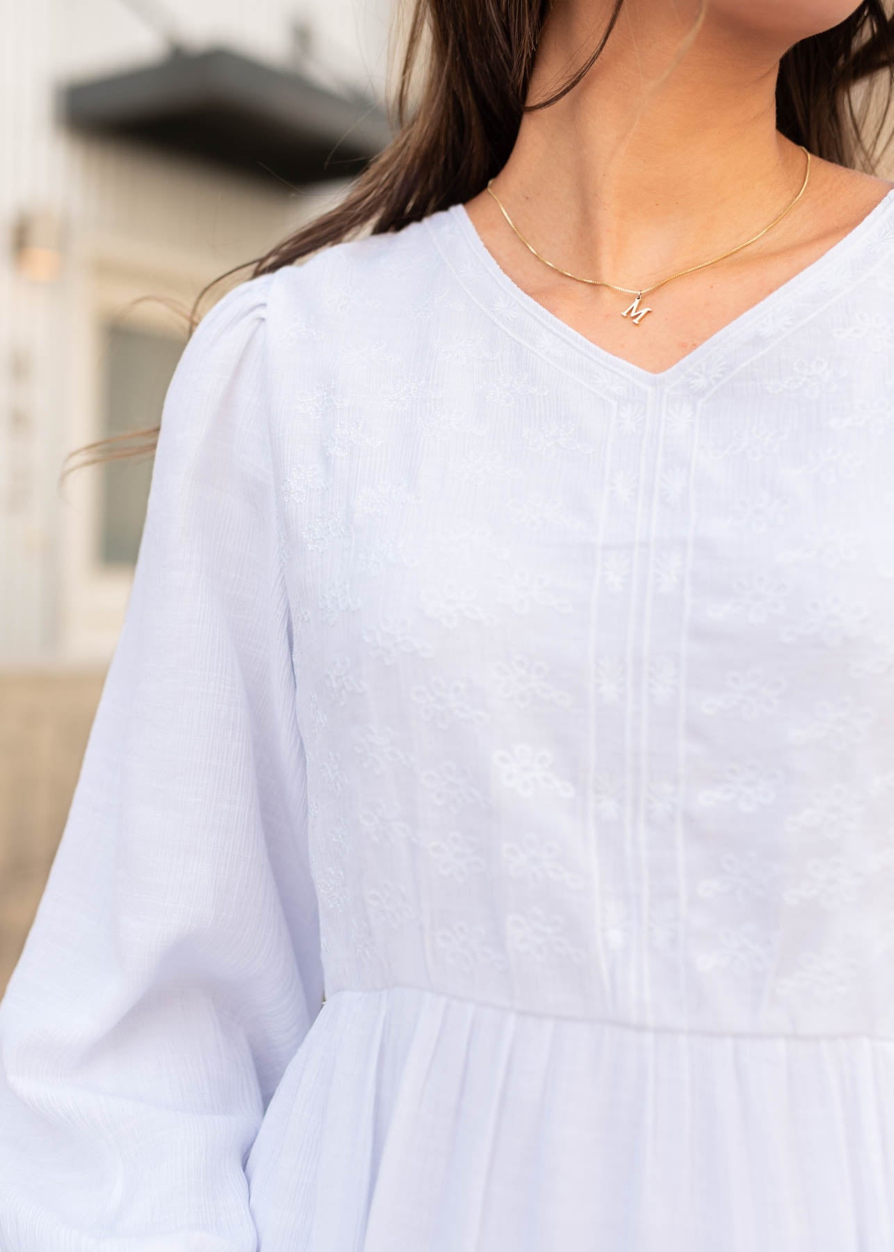 Close up of the white embroidered bodice dress