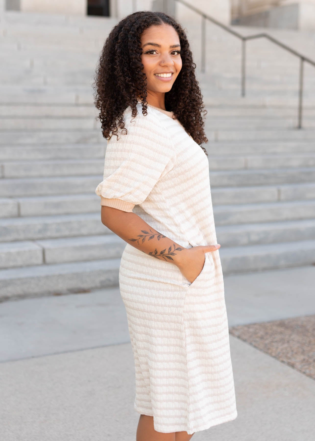 Side view of the beige striped dress