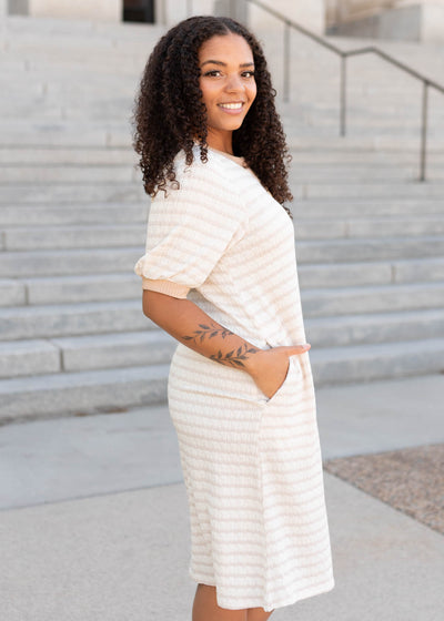 Side view of the beige striped dress