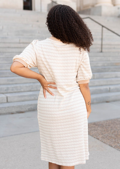 Back view of the beige striped dress