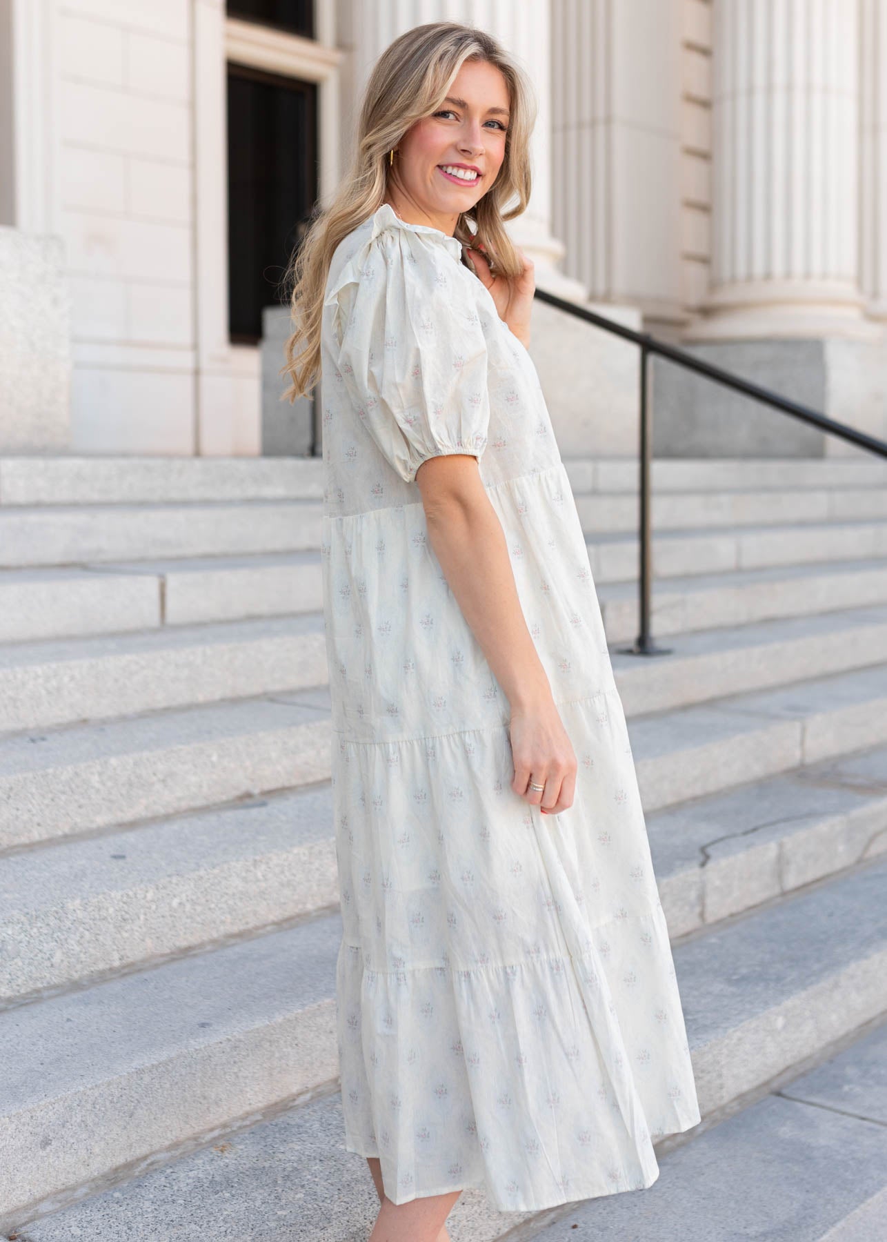 Side view of the vintage cream floral dress