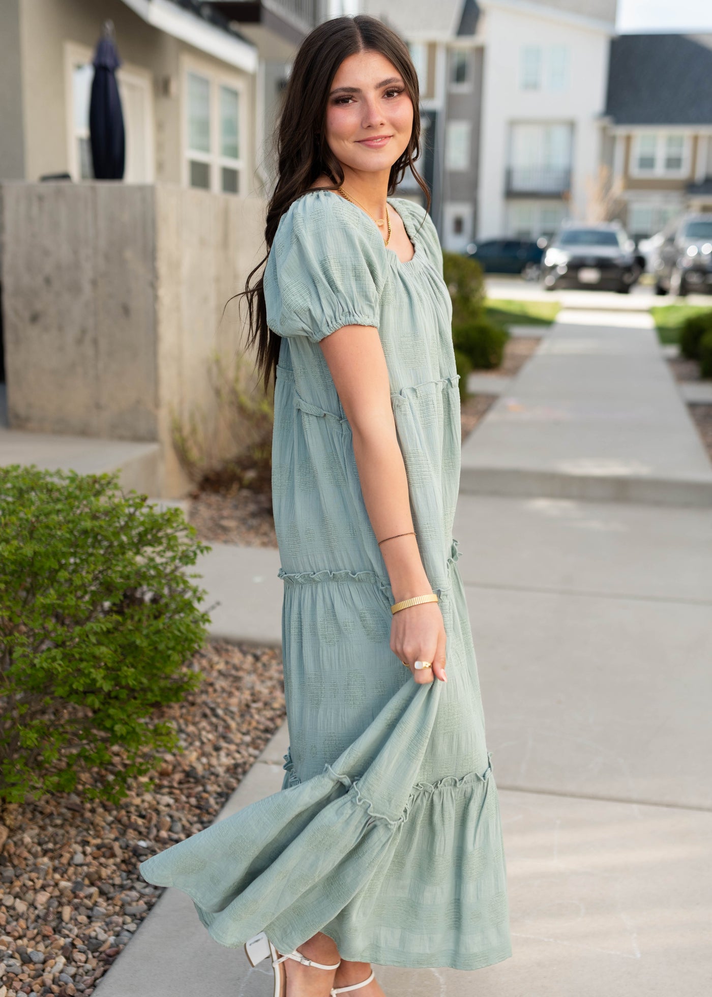 Side view of the sage puff sleeve detailed dress