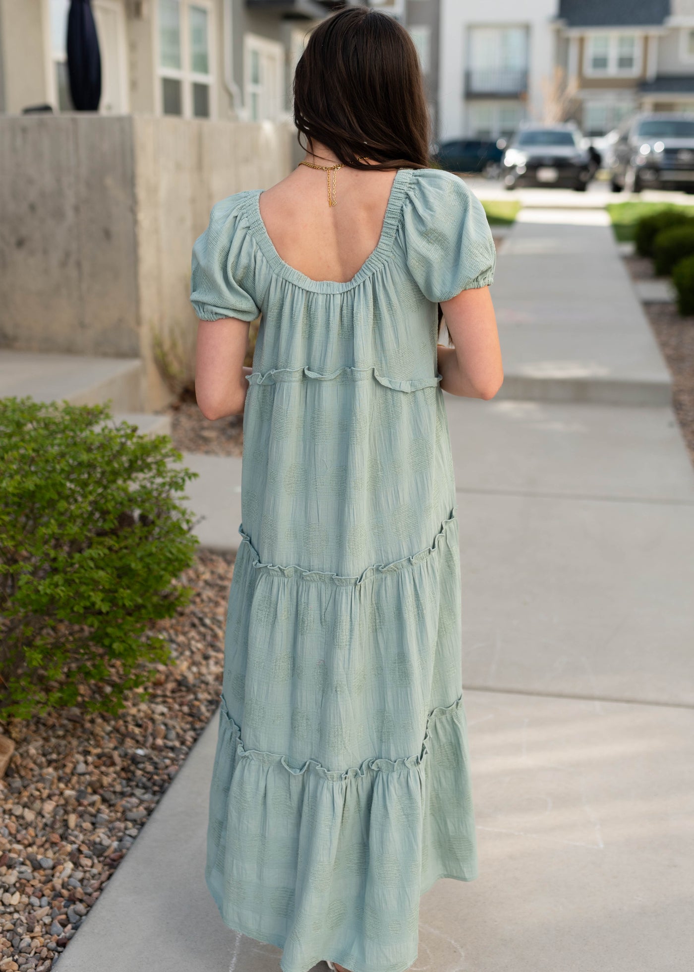 Back view of the sage puff sleeve detailed dress