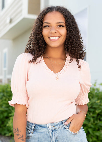 Blush pink top with ruffle at the neck