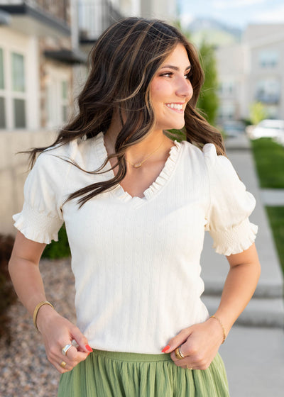 Short sleeve ivory top with wide band cuff