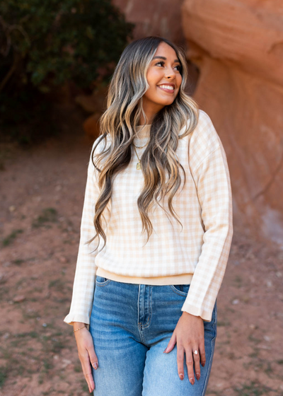 Ivory sweater with tan checkers