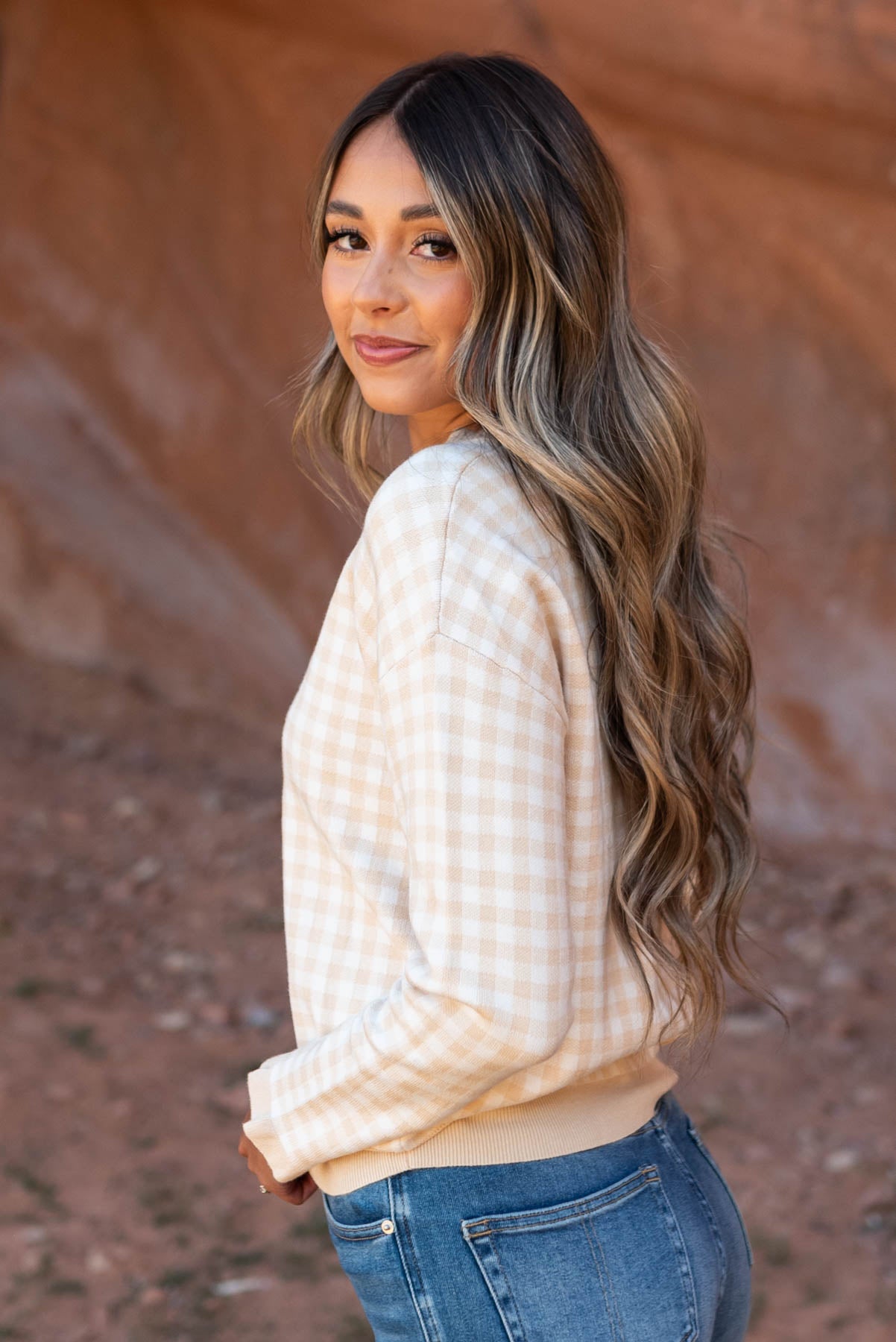 Side view of a ivory sweater