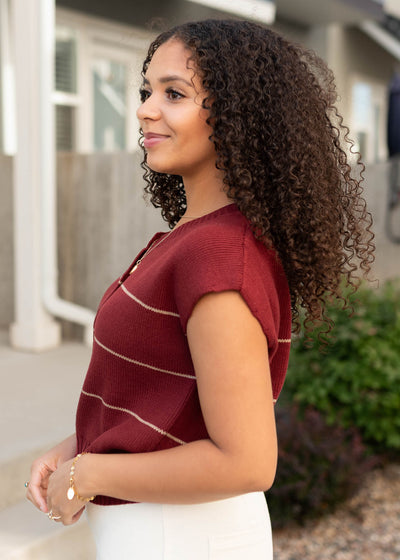 Side view of the burgundy stripe sweater