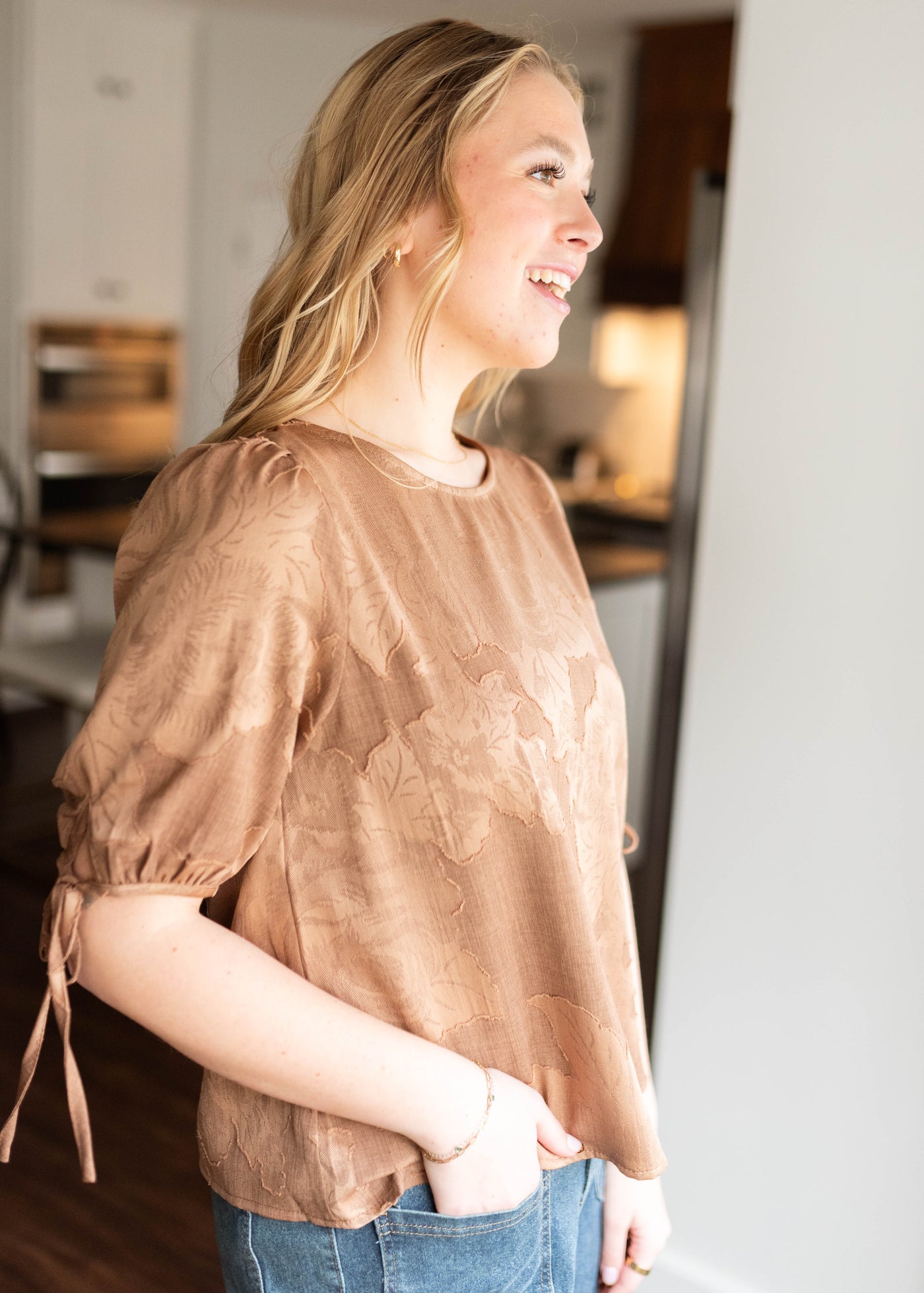Side view of the brown floral top