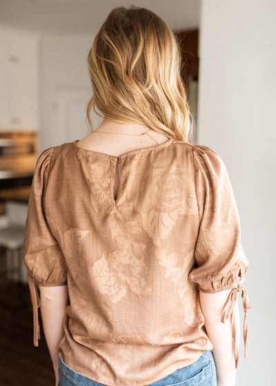 Back view of the brown floral top