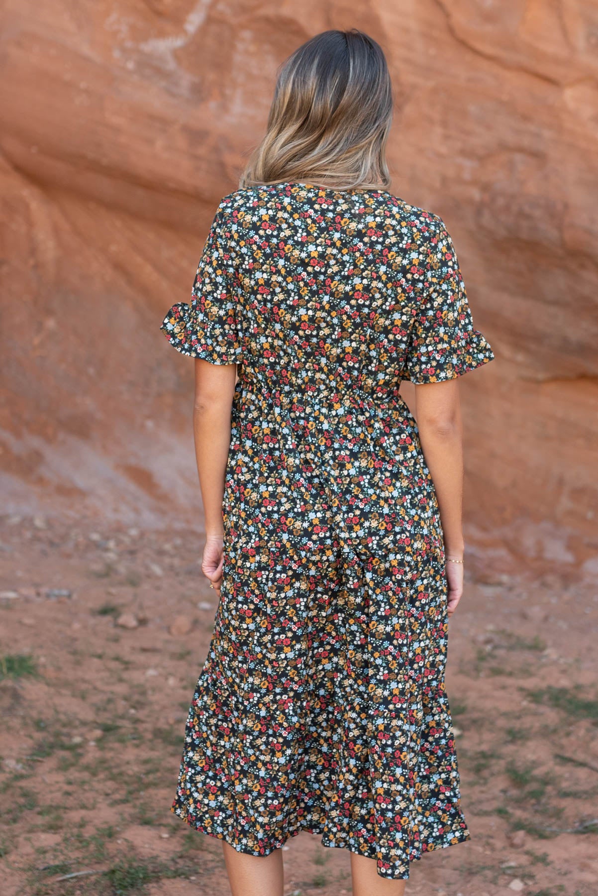 Back view of a black floral dress