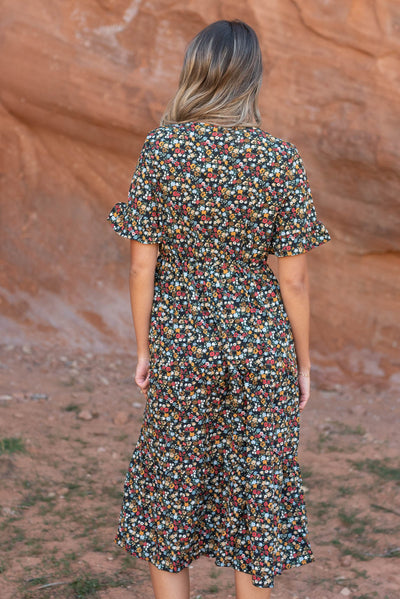 Back view of a black floral dress