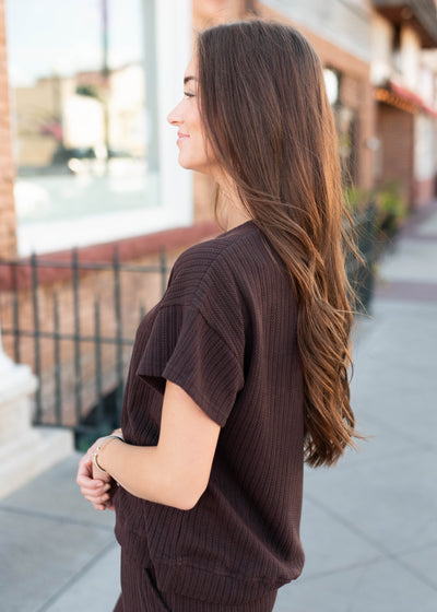 Side view of the dark brown top