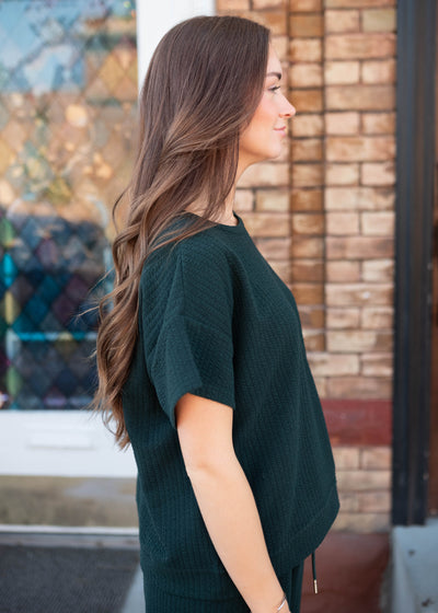 Side view of the forest green top