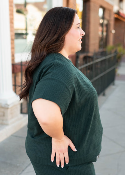 Side view of the plus size forest green top