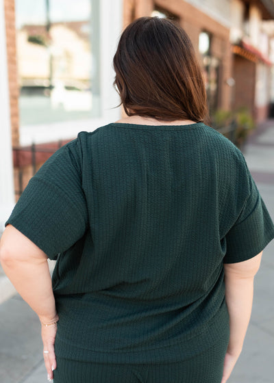 Back view of the plus size forest green top