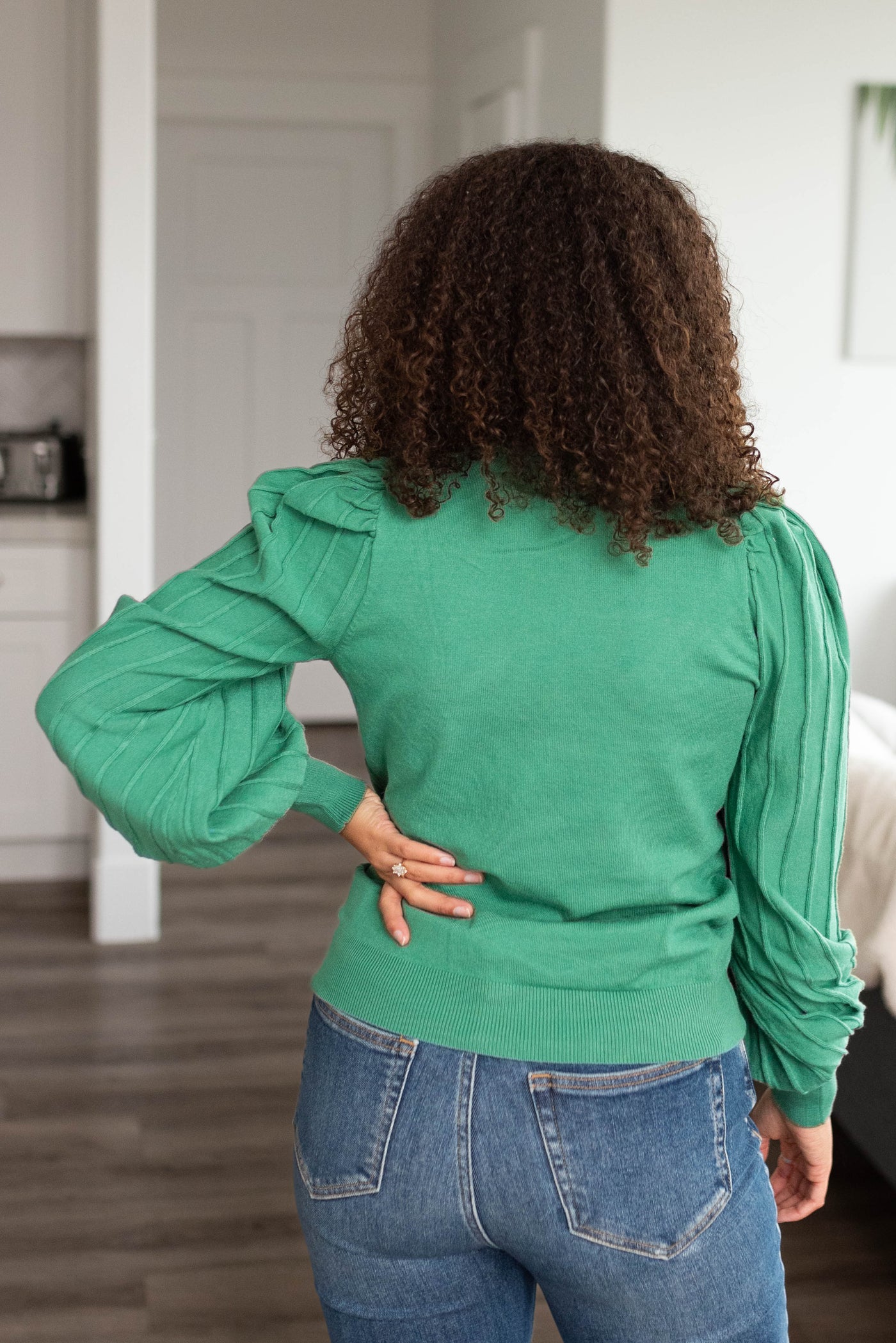 Back view of the rosemary green sweater