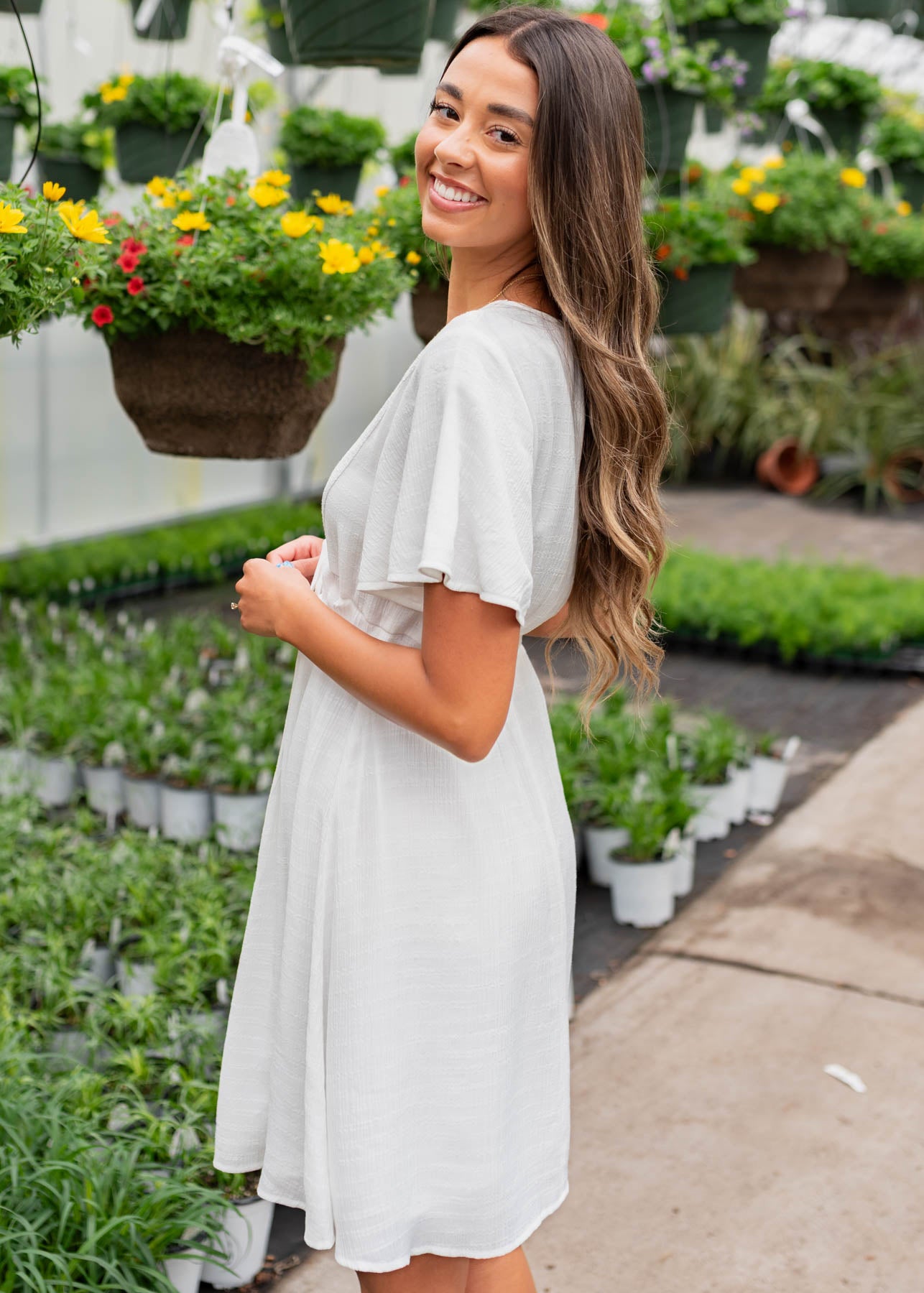 Side view of the white textured tie dress