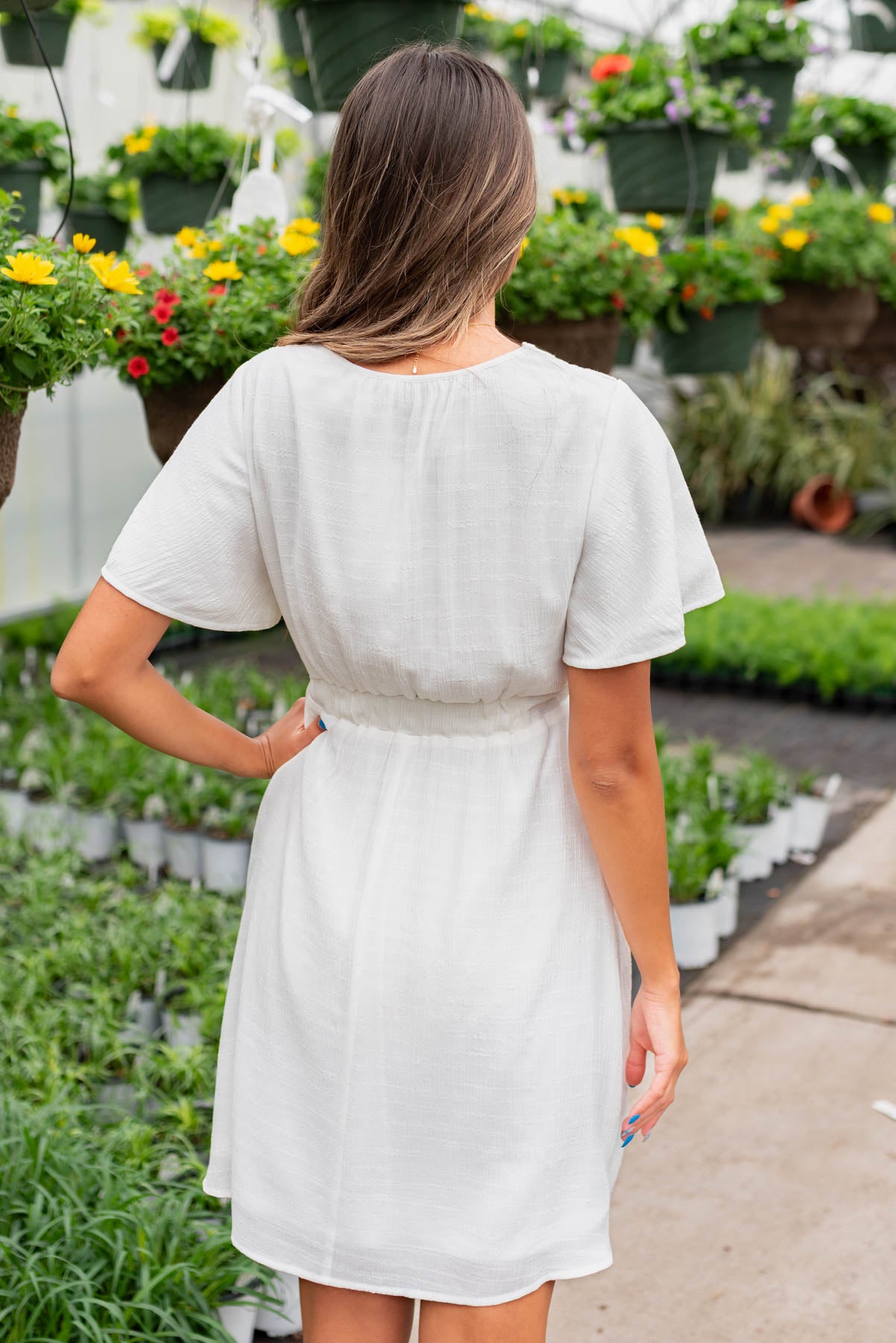 Back view of the white textured tie dress
