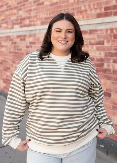 Cute plus size olive striped sweatshirt with ivory cuffs and waist band
