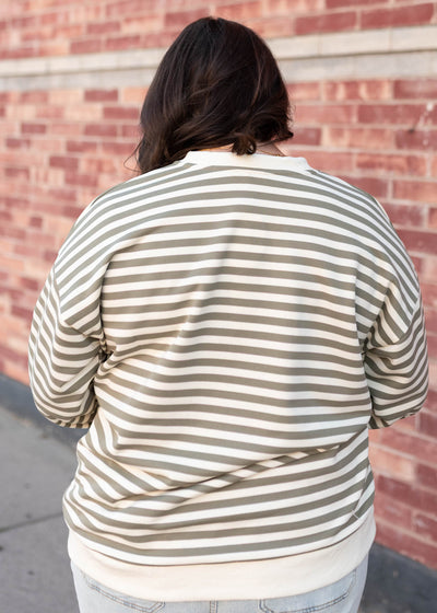 Back view of the olive striped sweatshirt in plus size